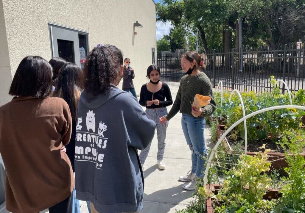 Scholarship recipients Sanika Newadkar and Julianne Ng conduct a Local Leaders meeting at Amador Valley High School. 